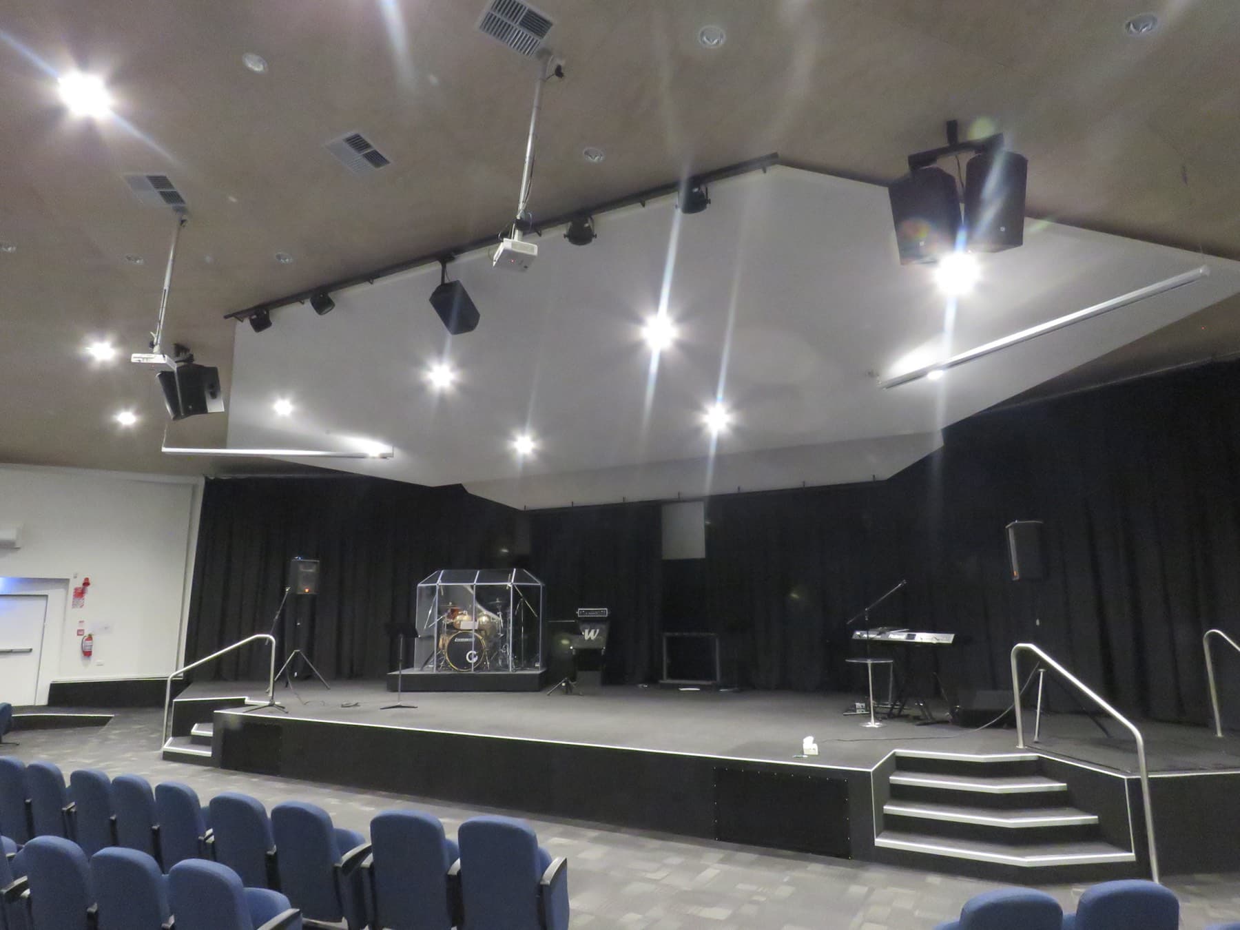The auditorium from the front: stage, lighting rig and the first rows of seating.